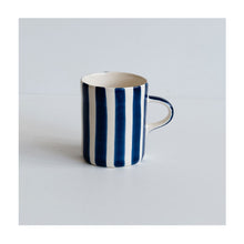 A colourful handcrafted mug from Musango in their Blue candy stripe glaze. 