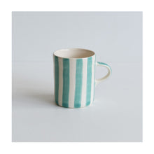  A colourful handcrafted mug from Musango in their Mint candy stripe glaze.