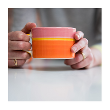  A colourful handcrafted mug from Musango in their Sunrise tri-colour glaze.