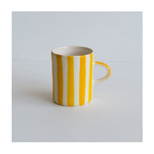  A colourful handcrafted mug from Musango in their Turmeric candy stripe glaze.