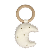  A handcrafted baby rattle made from 100% cotton and a wooden ring. The rattle is in the shape of a crescent moon in cream fabric with gold detailing.