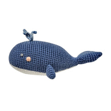  A crocheted baby rattle in the shape of a whale. Wilbert is navy blue with a white under belly, pink cheeks and blowhole detailing.