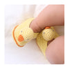 Handcrafted crocheted baby booties in the shape of chicks. Charly Chick booties are bright yellow with orange trims and orange beaks.