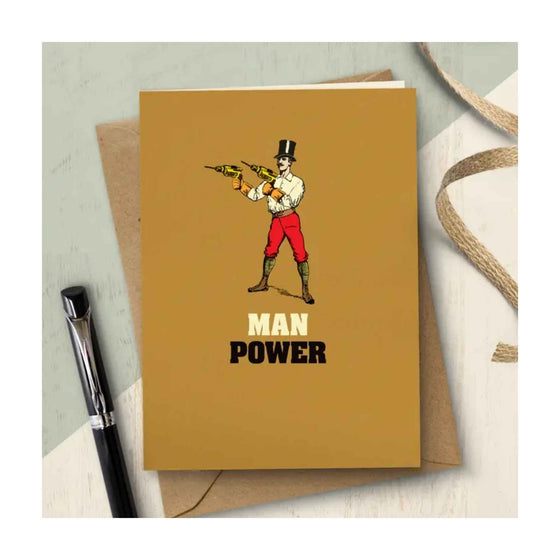 Card with a man in a Top Hat holding a drill in each hand. The text reads 'Man Power'.