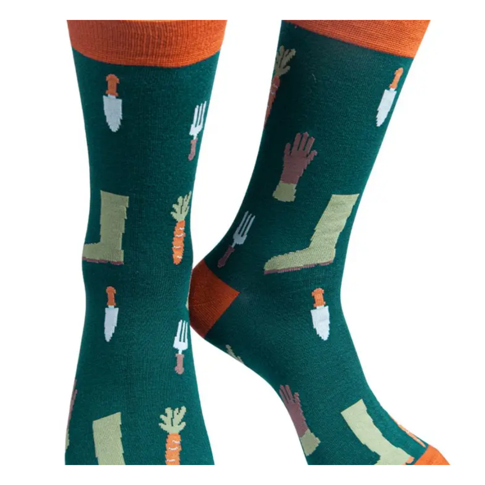 Pair of socks with gardening-themed design on a white background