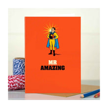  A bold, quirky illustrated card by The Typecast Gallery. It features a vintage-style illustration of a man in a splendid superhero costume, above the words "Mr Amazing". For the superhero in your life.&nbsp;