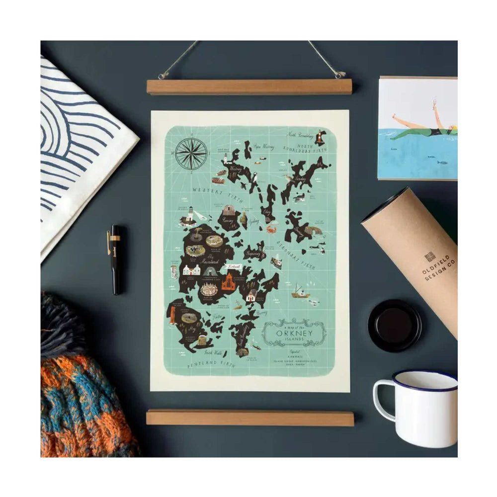 
                  
                    Map of Orkney on a dark surface with stationery items
                  
                