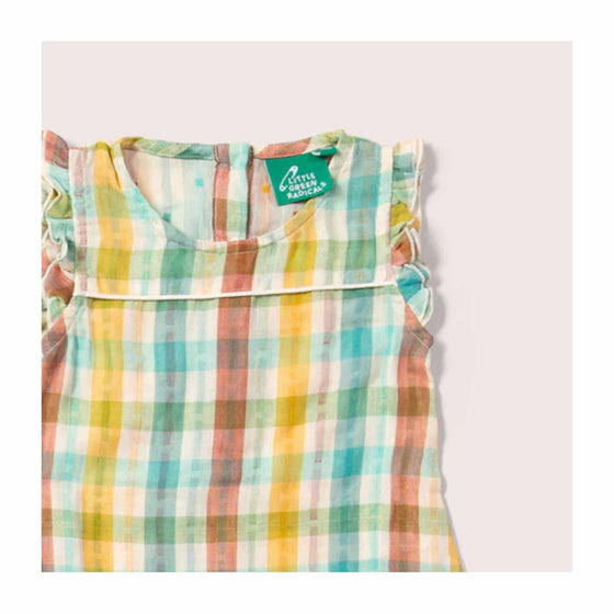 A summer baby romper in a multi-coloured check pattern.