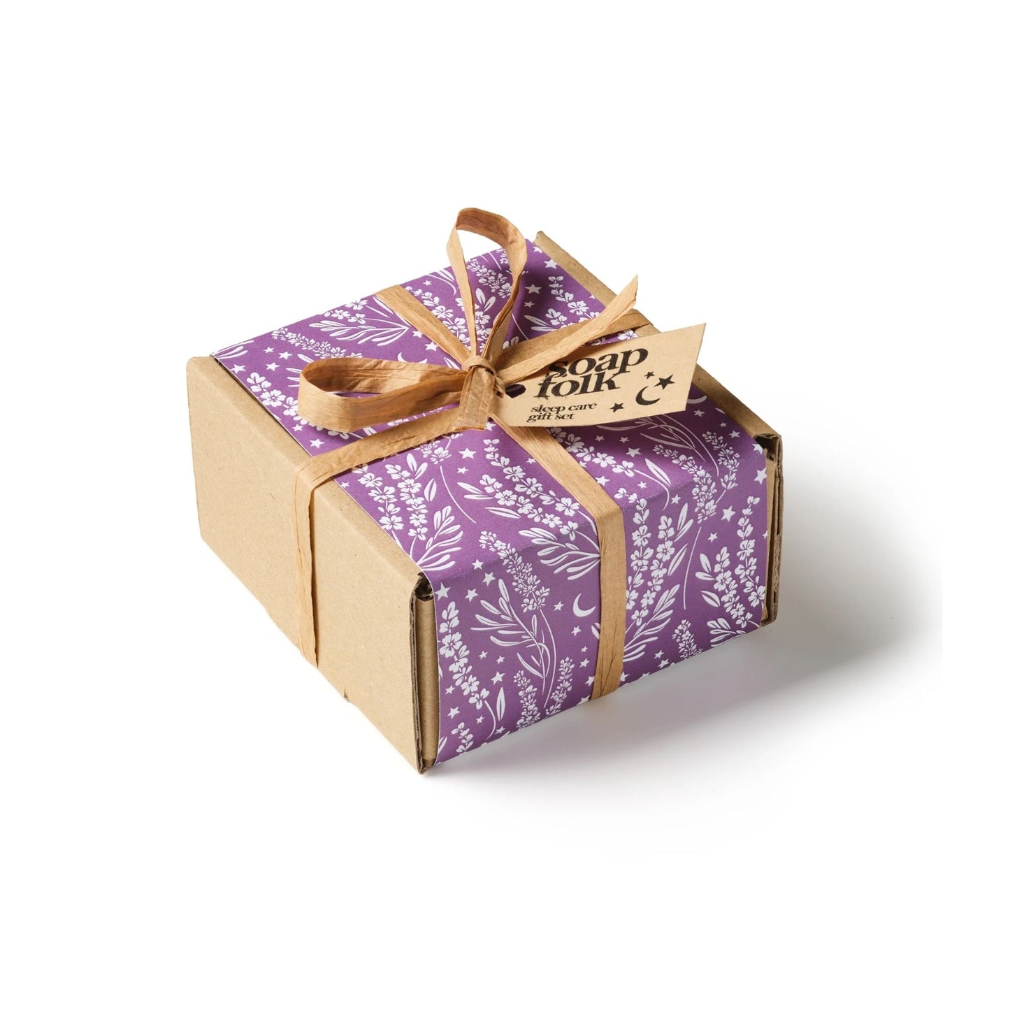 Gift box with purple floral wrapping paper and brown ribbon on a white background