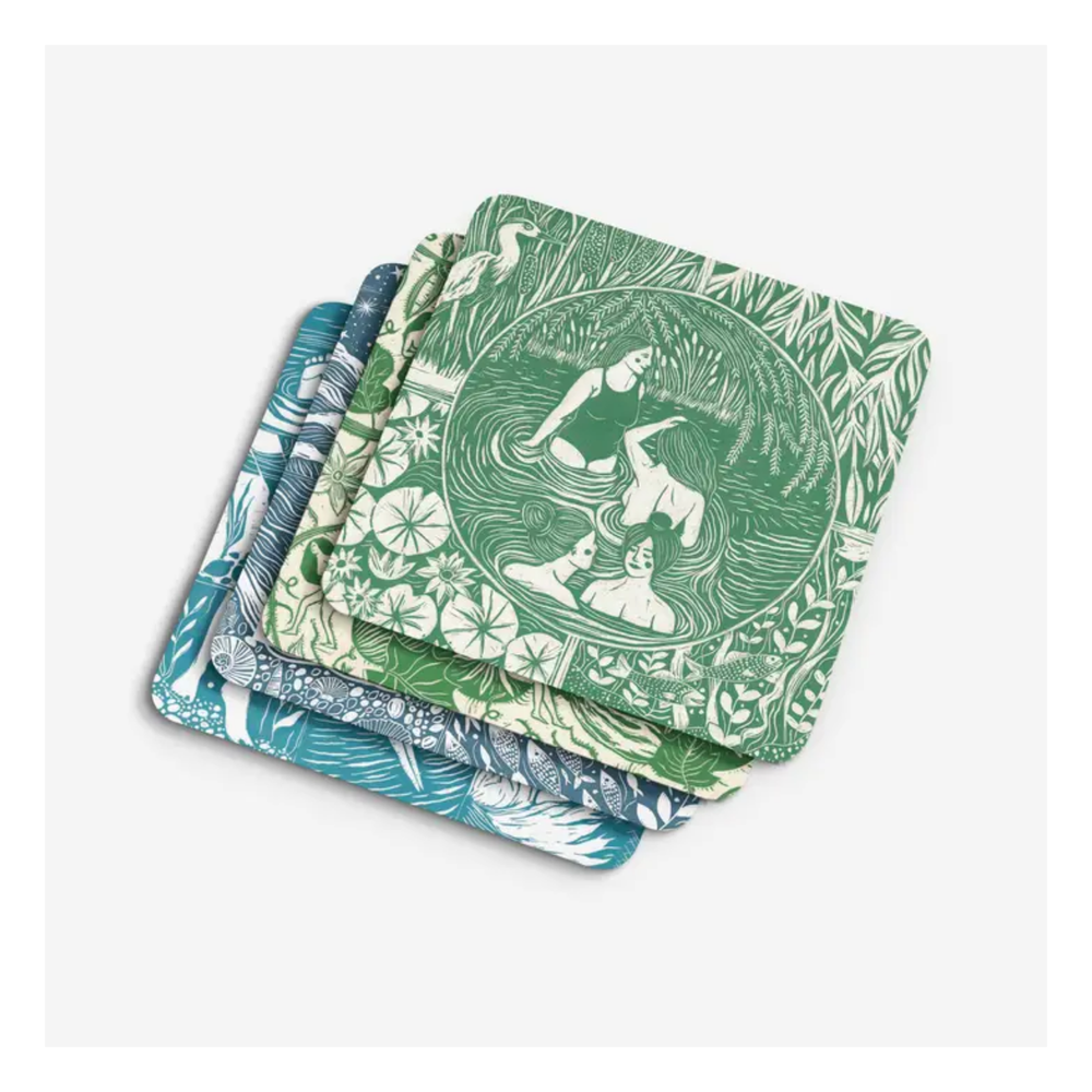Set of four patterned coasters with green and blue designs on a white background.
