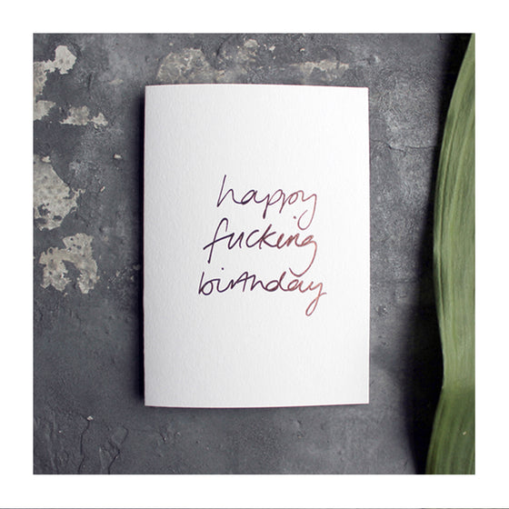 A letter press greeting card with gold foil.