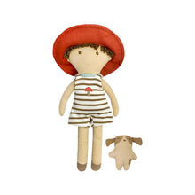  A super soft jersey doll with a linen hat and detached dog friend. Hugo wears a striped romper with a mushroom embroidered on the front and a red hat.