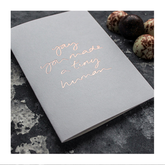 A letter press greeting card with gold foil.