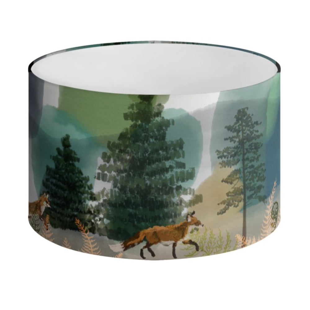 
                  
                    An illustrated lampshade featuring a woodland scene with foxes by Tori Gray / Harbour Lane Studio.
                  
                