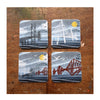 Set of 4 cork backed, melamine coasters featuring 4 different illustrations of the 3 Forth Bridges by Tori Gray. 