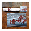 Set of 4 cork backed, melamine rectangular tablemats featuring 4 different illustrations of the 3 Bridges by Tori Gray.