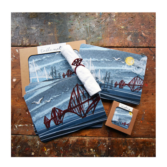 Set of 4 cork backed, melamine rectangular tablemats featuring 4 different illustrations of the 3 Bridges by Tori Gray.